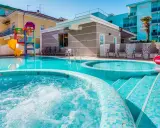 Piscine scintillanti e scivoli colorati in un adriatico family village, perfetti per il divertimento di tutta la famiglia.